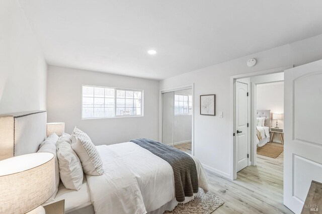 bedroom with light hardwood / wood-style floors