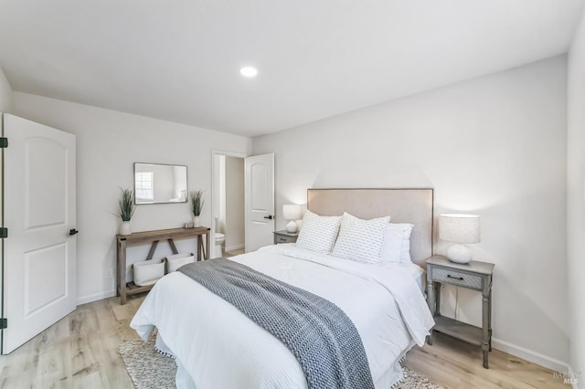 bedroom with light hardwood / wood-style floors