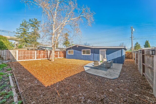 rear view of property featuring a patio