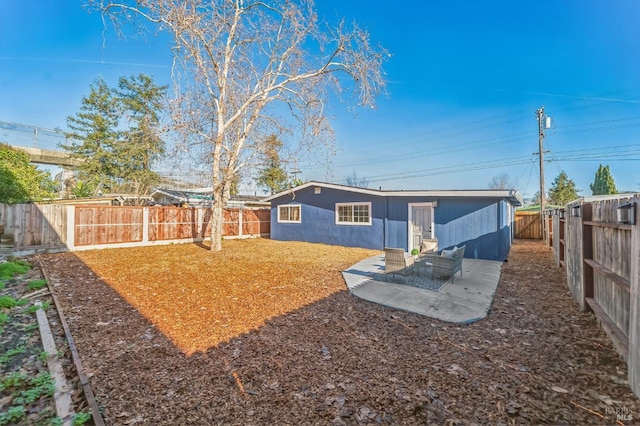 rear view of house with a patio