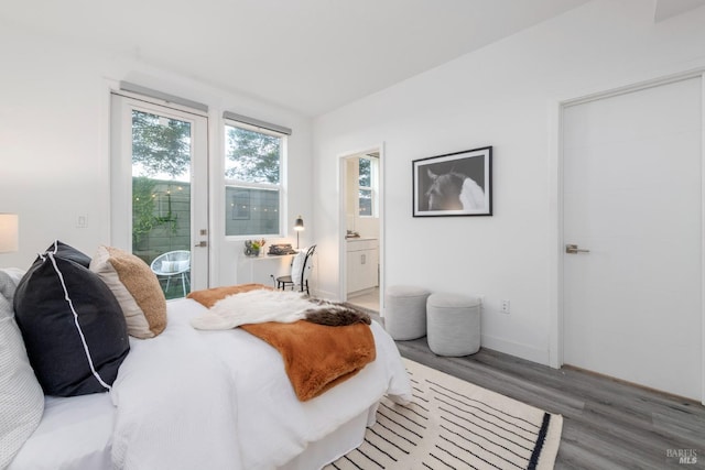 bedroom with hardwood / wood-style floors