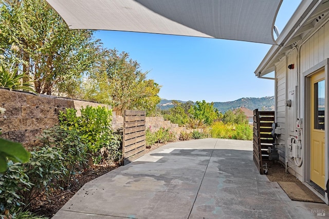 view of patio / terrace featuring a mountain view