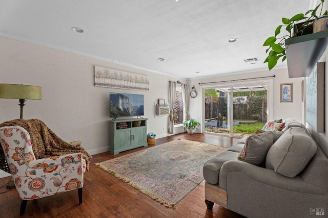 living room featuring dark wood-type flooring and ornamental molding