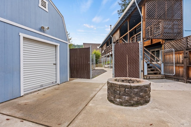 view of patio / terrace featuring an outbuilding and a garage