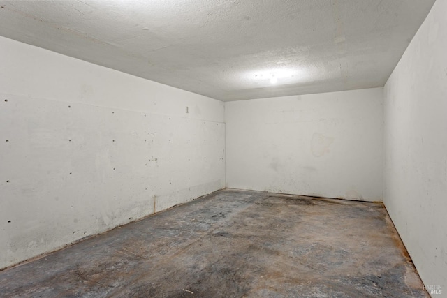 unfurnished room featuring a textured ceiling