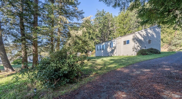 view of home's exterior featuring a yard