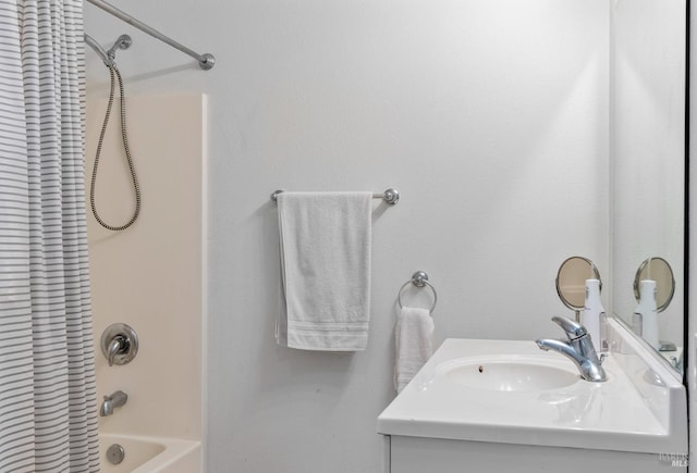 bathroom featuring shower / bath combination with curtain and vanity