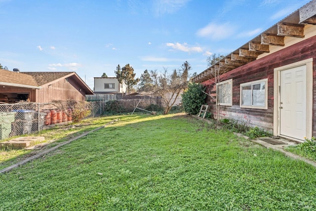 view of yard with a fenced backyard