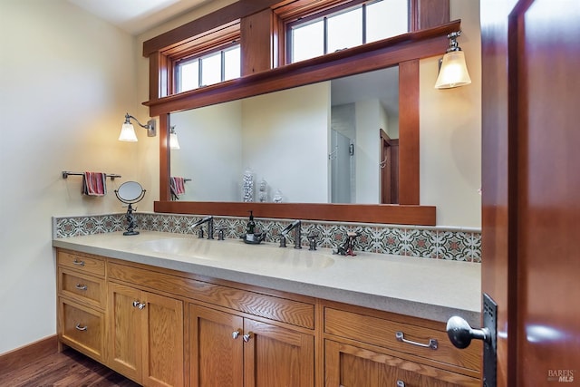 bathroom featuring hardwood / wood-style flooring and vanity