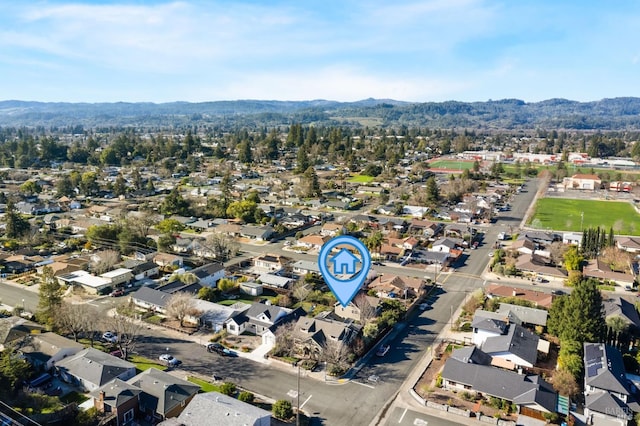 drone / aerial view featuring a mountain view