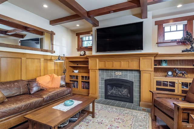 living room featuring a fireplace and beamed ceiling