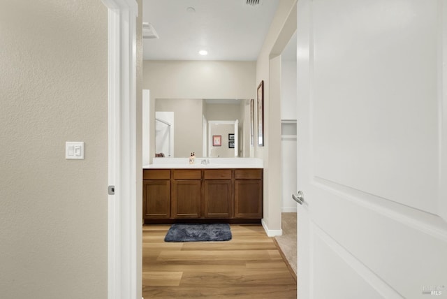 bathroom featuring vanity and wood-type flooring