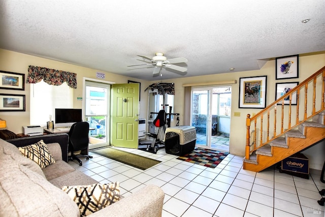 office area with ceiling fan, light tile patterned flooring, and a textured ceiling