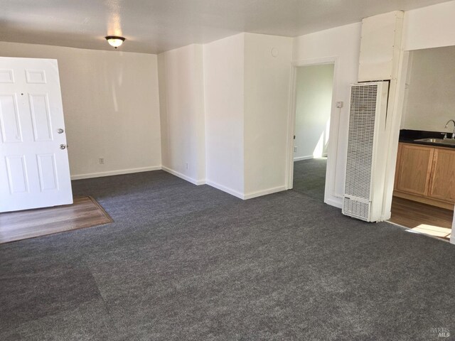 carpeted empty room with sink