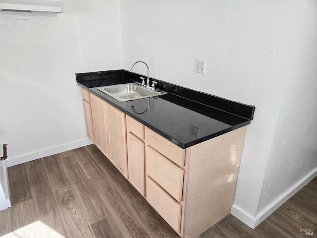 1920 Marin St, Vallejo, CA 94590 - interior space featuring dark wood finished floors, light brown cabinetry, dark countertops, a sink, and baseboards