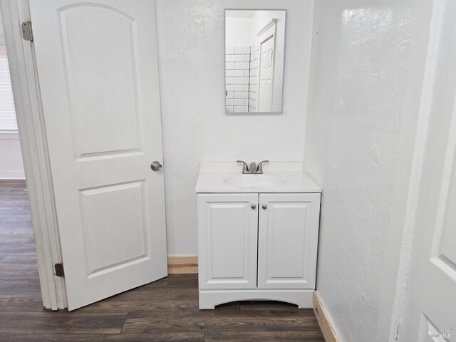 bathroom with vanity and wood-type flooring