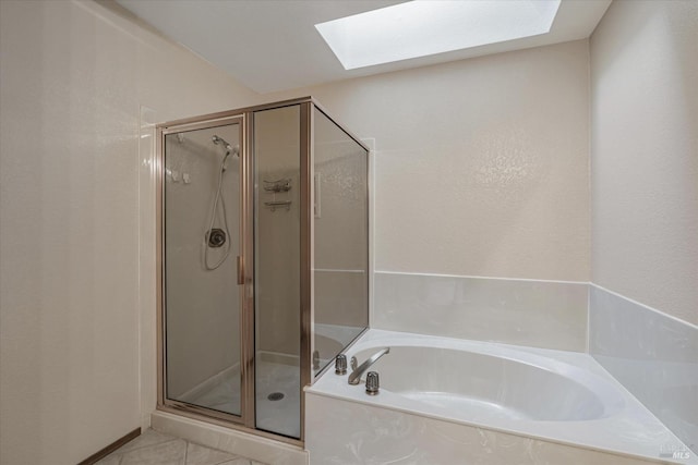 bathroom featuring tile patterned floors, plus walk in shower, and a skylight