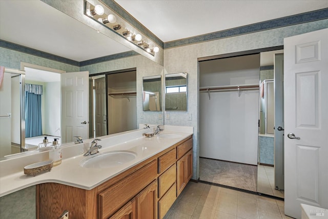 bathroom featuring tile patterned floors and vanity