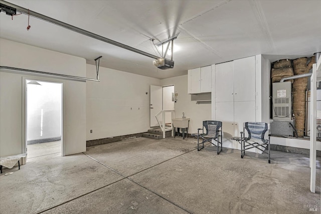 garage featuring a garage door opener and sink