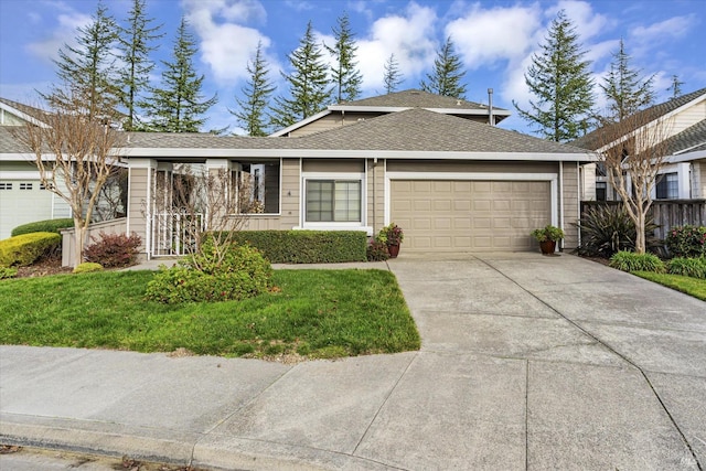 ranch-style house featuring a front yard and a garage