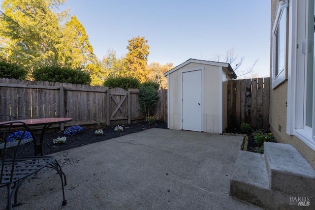 view of patio with a storage unit