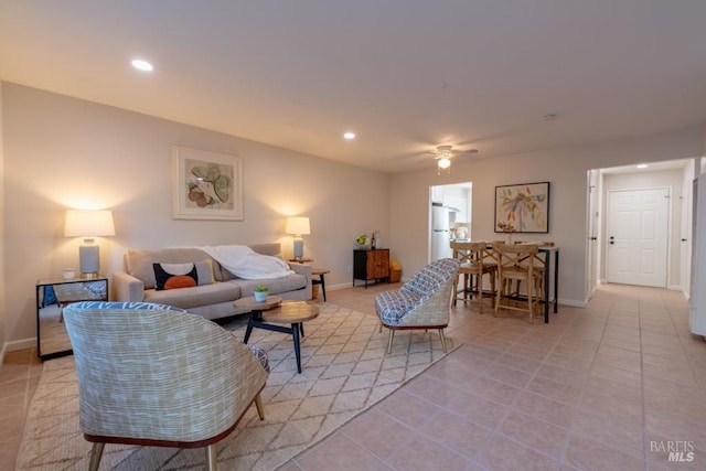 tiled living room with ceiling fan