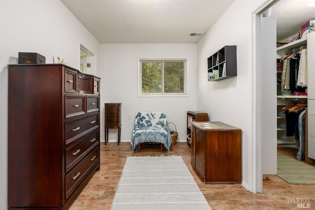 sitting room featuring light hardwood / wood-style floors