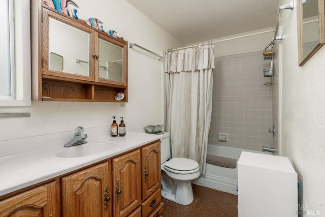 full bathroom with tile patterned floors, shower / bath combo, toilet, and vanity