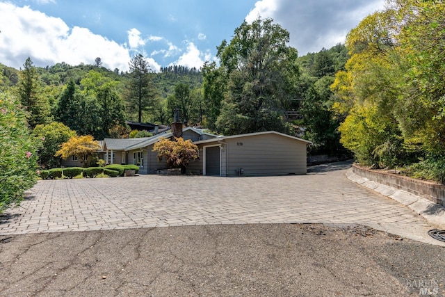 ranch-style house featuring a garage