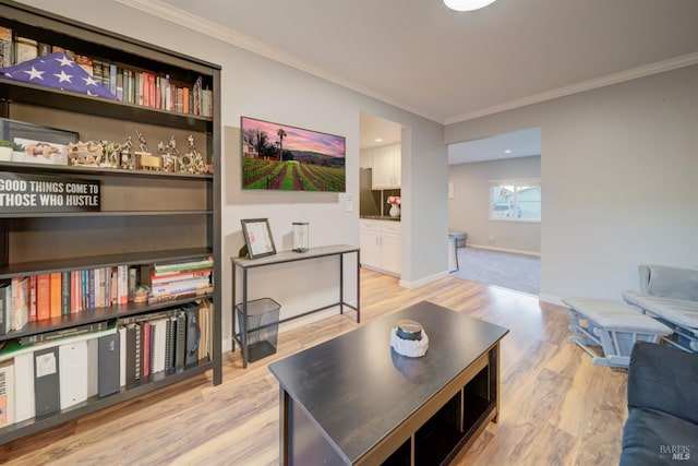 living room featuring light wood-type flooring and ornamental molding