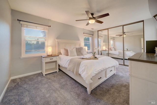 carpeted bedroom with ceiling fan and a closet