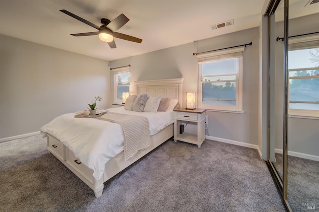 bedroom with ceiling fan and carpet floors