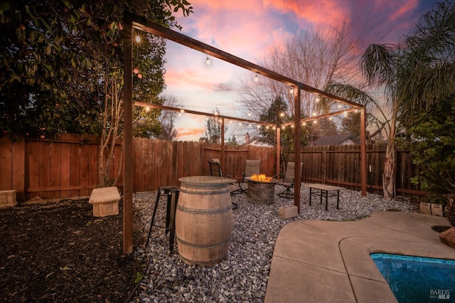 view of patio terrace at dusk