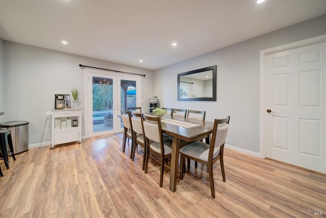 dining area with light hardwood / wood-style flooring