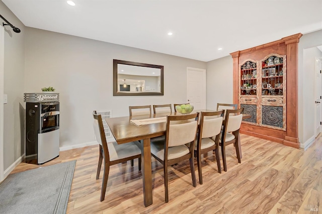 dining space featuring light hardwood / wood-style floors