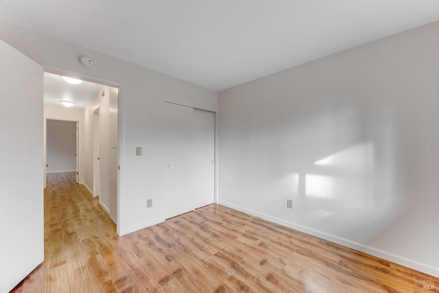 unfurnished room with light hardwood / wood-style flooring