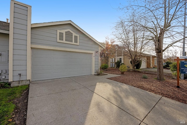 ranch-style house featuring a garage