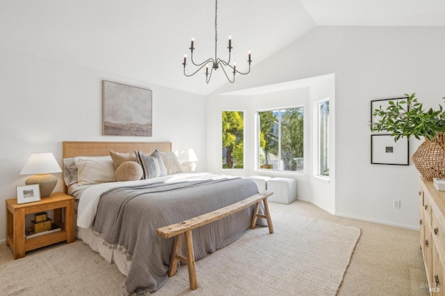 carpeted bedroom with vaulted ceiling and a notable chandelier