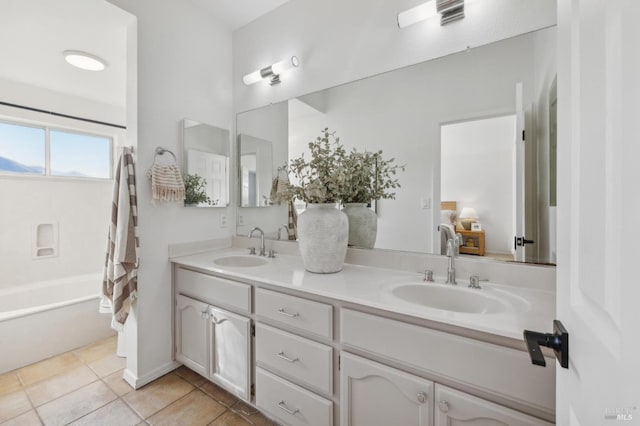 bathroom featuring tile patterned floors, vanity, and shower / bathtub combination with curtain