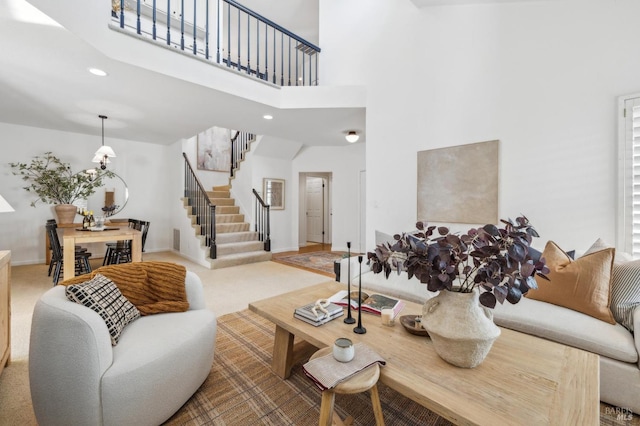 living room featuring a towering ceiling