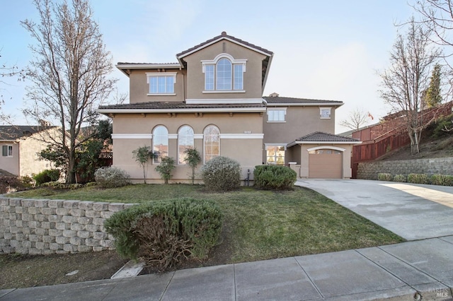 view of front of house with a garage and a front lawn