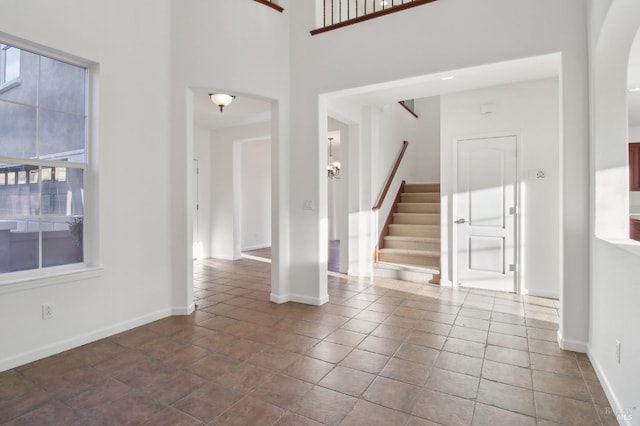 entryway featuring a high ceiling