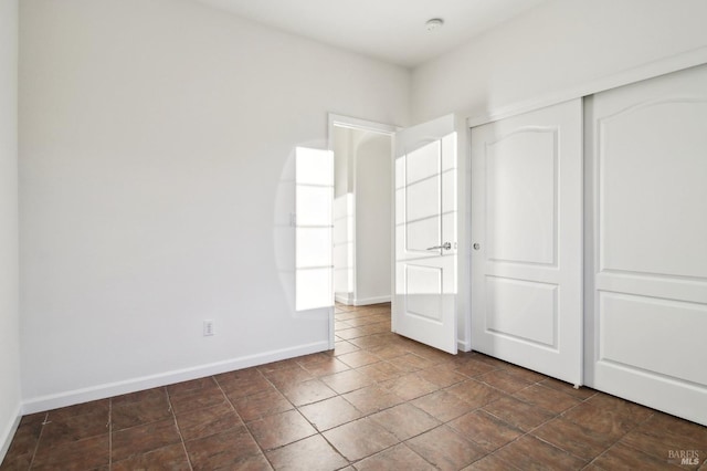 unfurnished bedroom with a closet