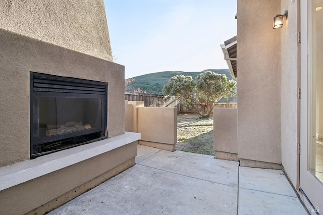 view of patio / terrace featuring a mountain view