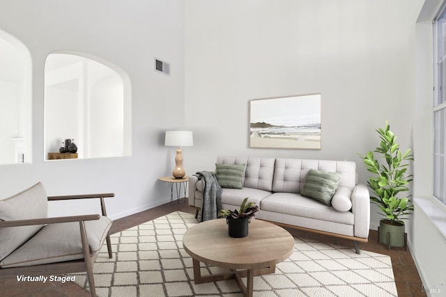 unfurnished dining area featuring baseboards, tile patterned floors, and a chandelier