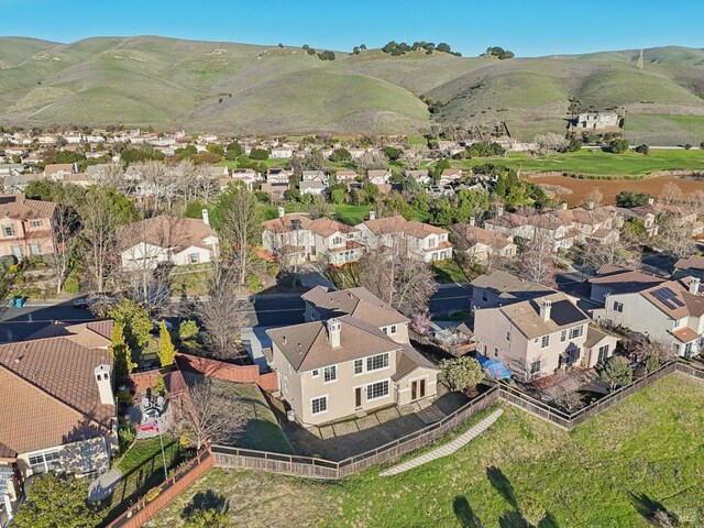 drone / aerial view with a residential view and a mountain view