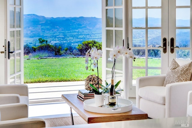 doorway to outside featuring french doors and a mountain view