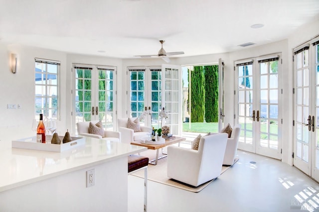 sunroom featuring french doors and visible vents