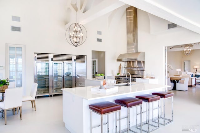 kitchen featuring a chandelier, light countertops, hanging light fixtures, and visible vents