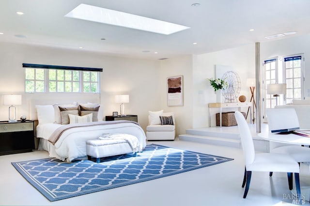 bedroom with a skylight and recessed lighting